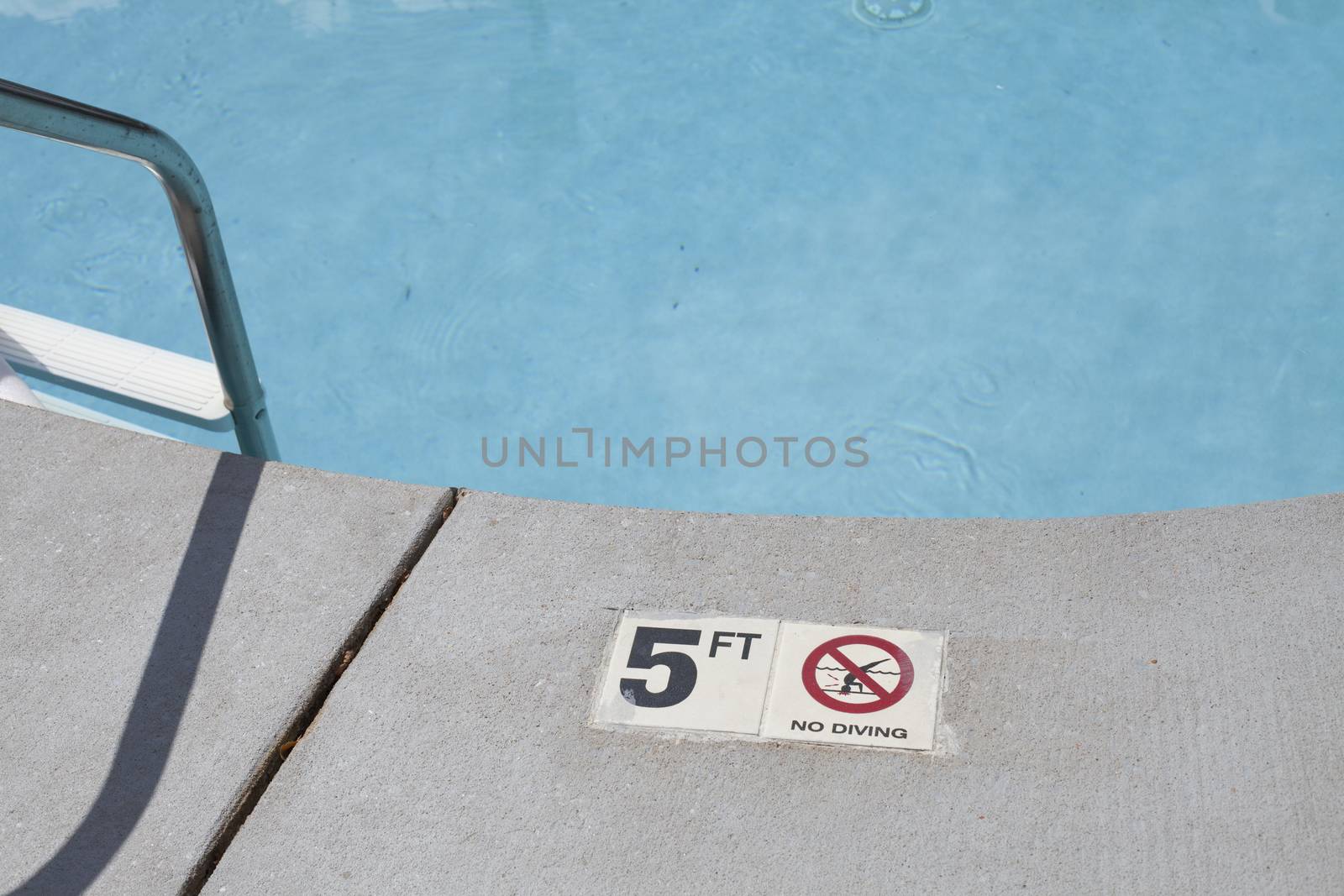 Sign indicating the depth of a swimming pool area