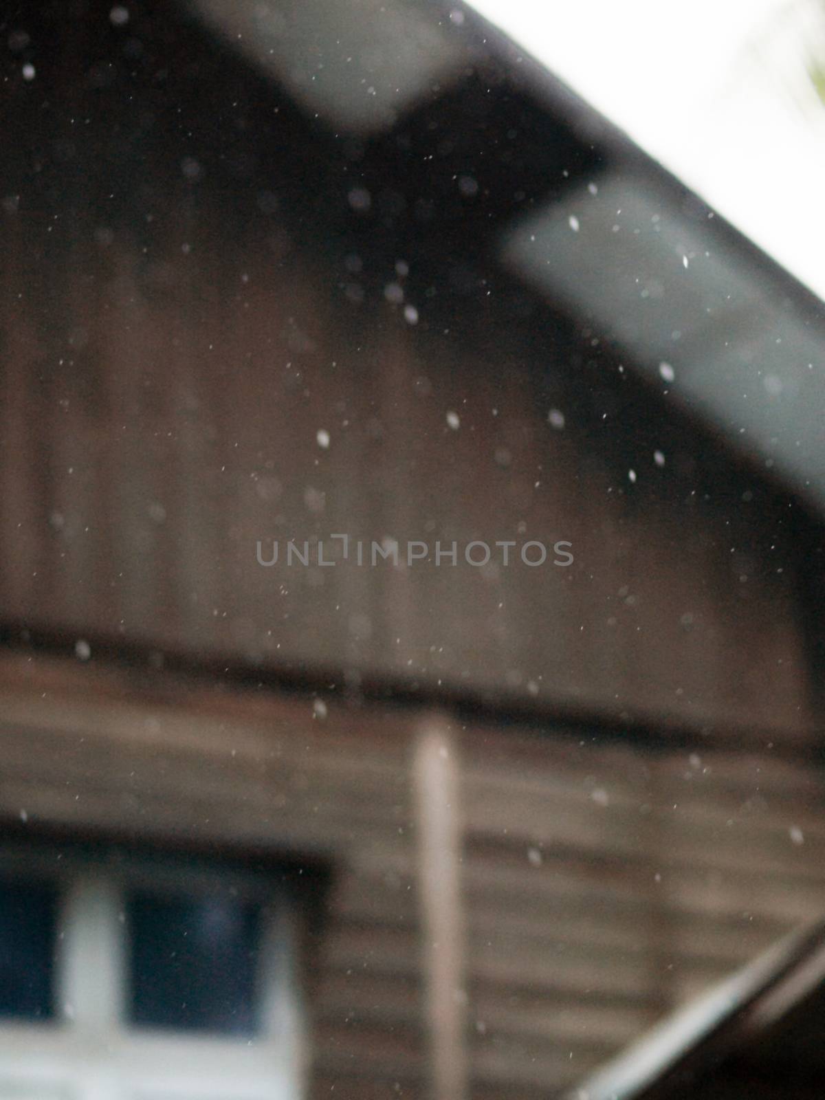 COLOR PHOTO OF BLURRY SHOT OF RAINDROPS