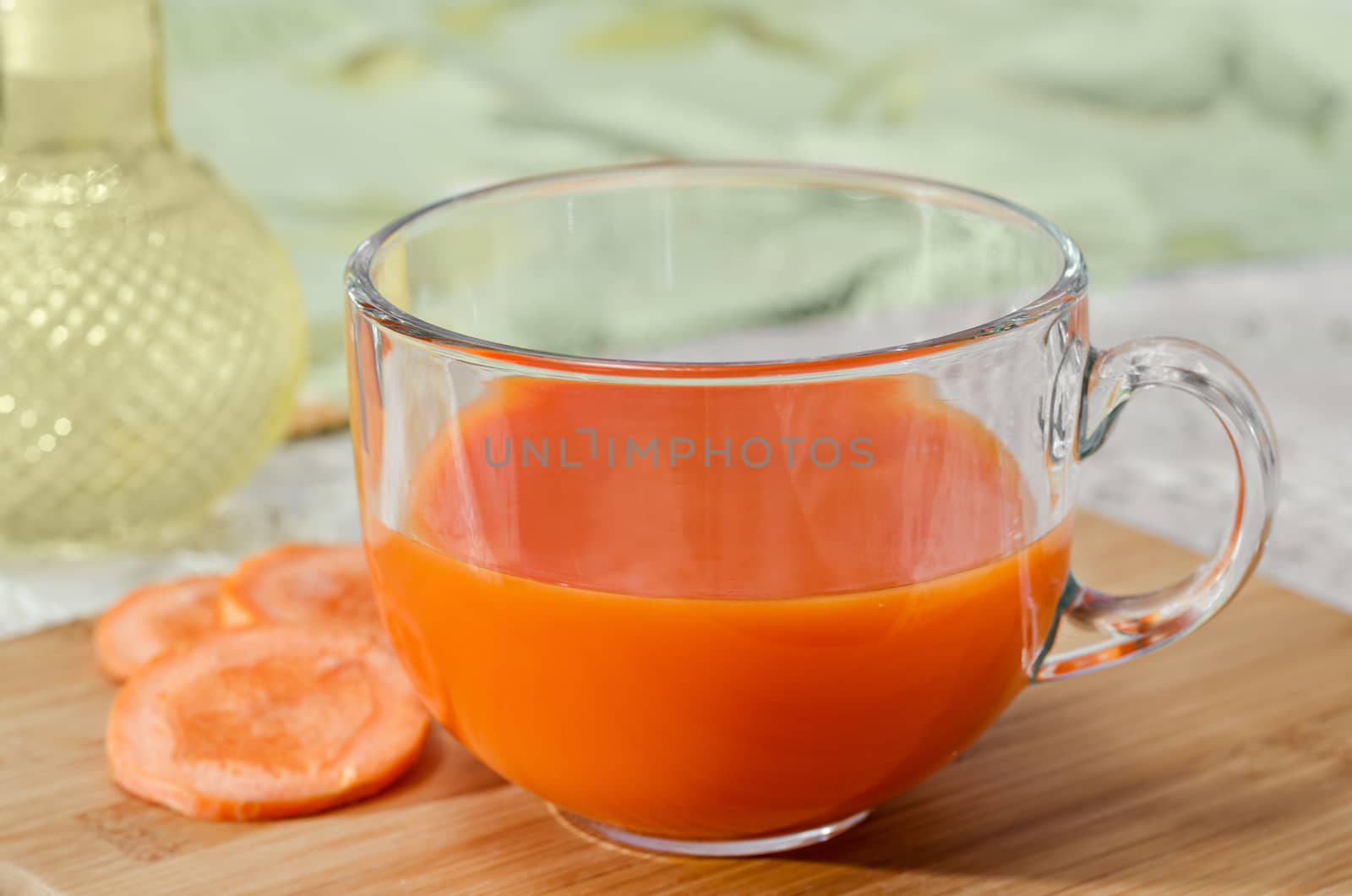 Fresh carrot juice in the Cup. Selective focus. by Gaina