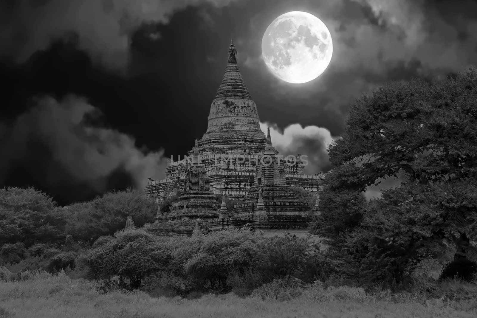 Ancient pagodas in the countryside from Bagan in Myanmar by full moon