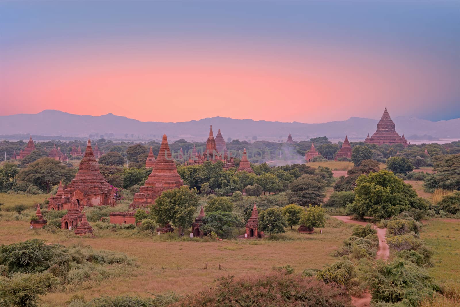 Ancient pagodas in the landscape from Bagan in Myanmar at sunset