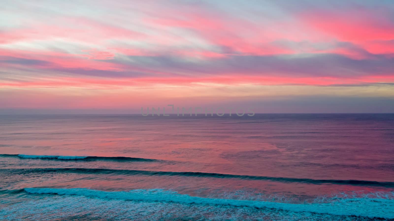 Aerial from a beautiful sunset at Vale Figueiras beach in Portugal