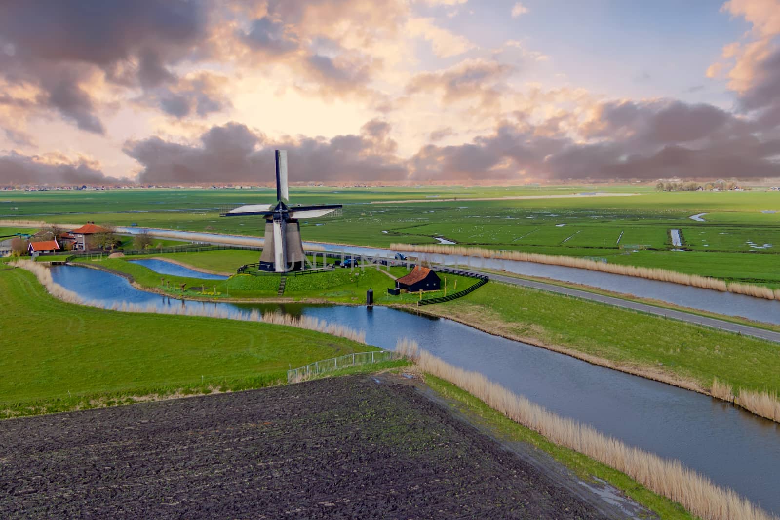Traditional windmill in a dutch landscape in the Netherlands
