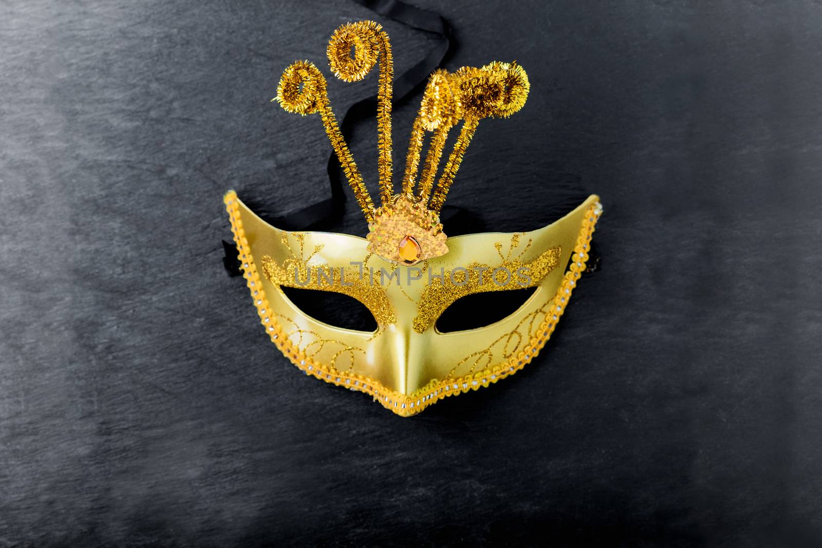 Carnival mask on a black background. Purim Symbols
