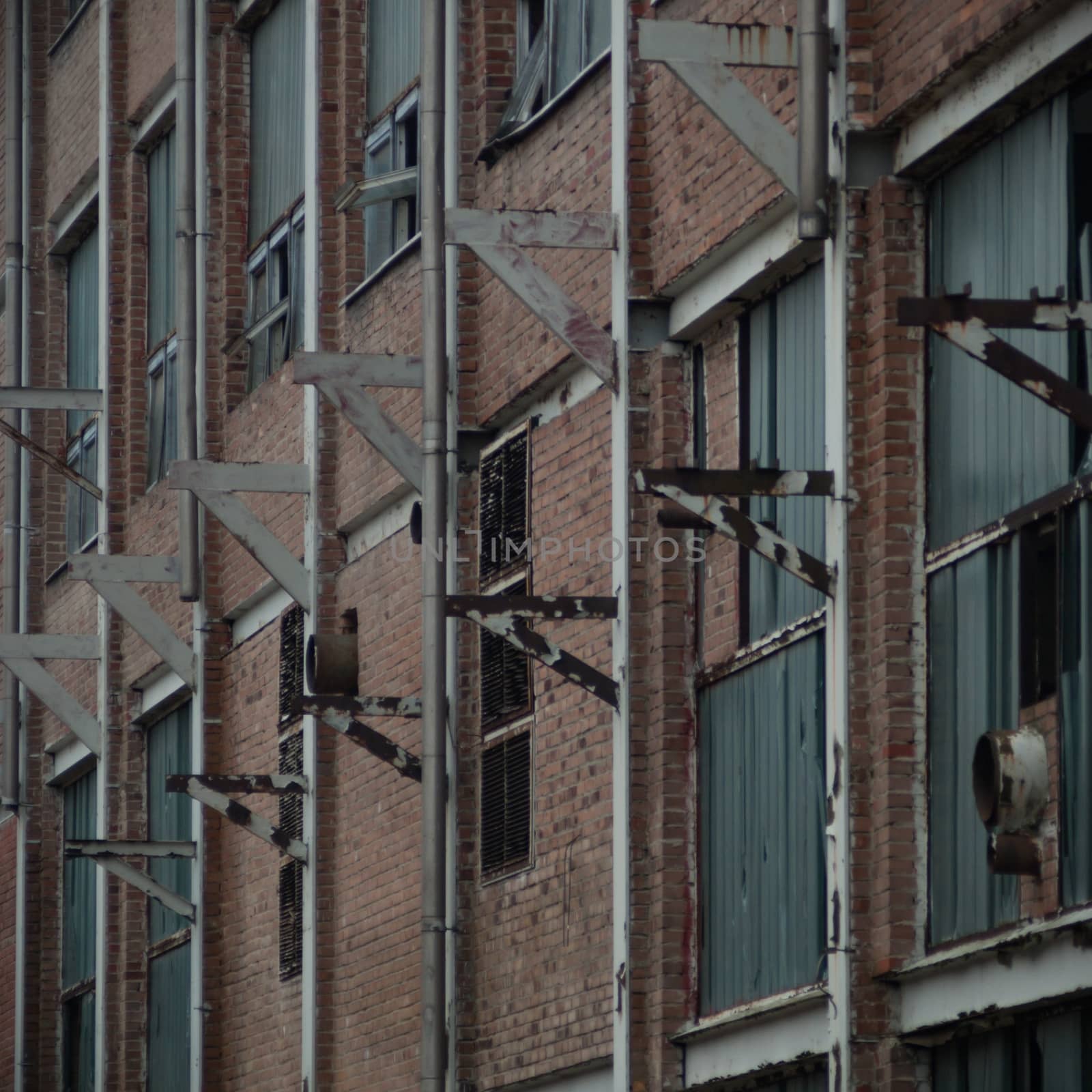 discarded ruin with old windows and wall, industrial window in concrete wall