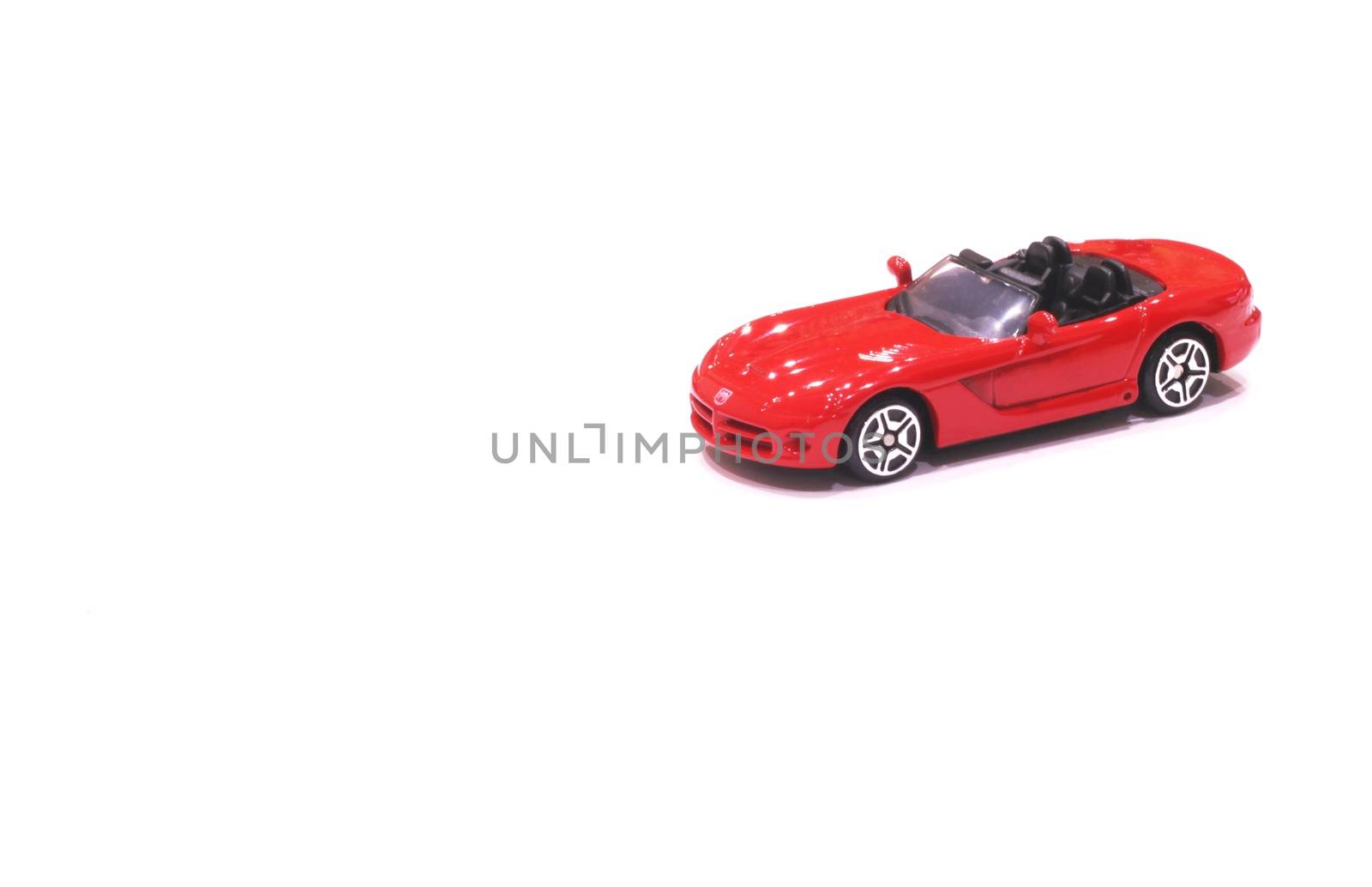 Red toy car  on a white background