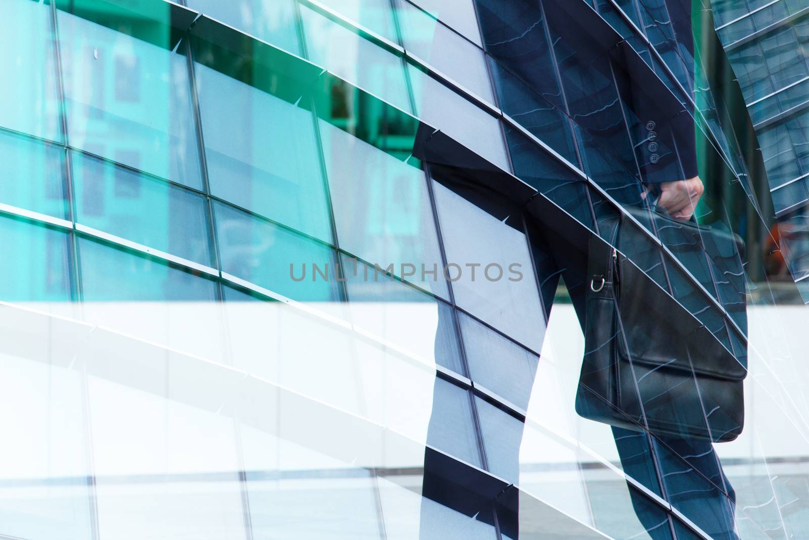 Abstract double exposure of businessman and office buildings, rush hours concept