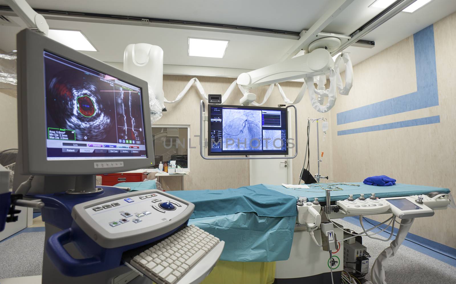 A surgery room in a hospital full of modern equipment. Nobody.