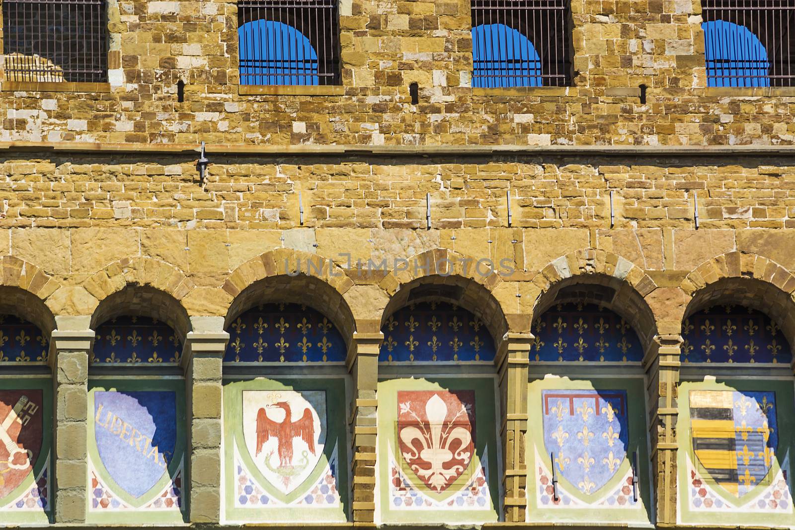 Detail emblems of the Florentine Republic on the facade of the Palazzo Vecchio in Florence