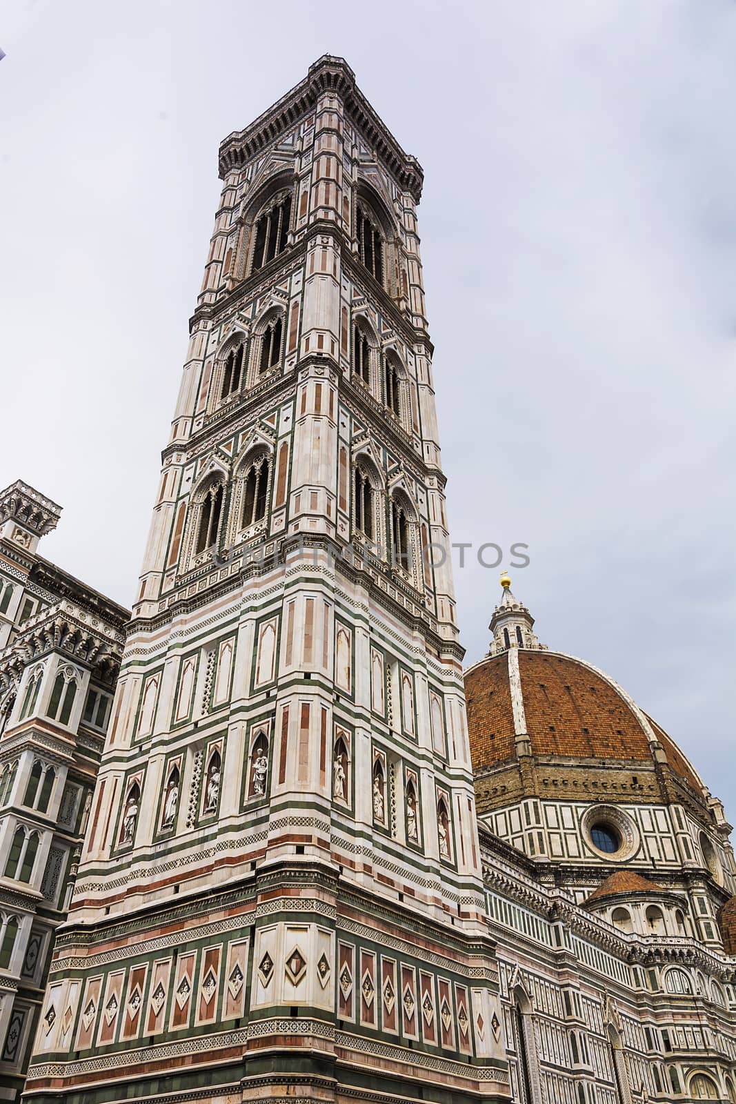 Duomo Santa Maria Del Fiore and Giotto belfry Campanile in Florence, Italy in a cloudy day