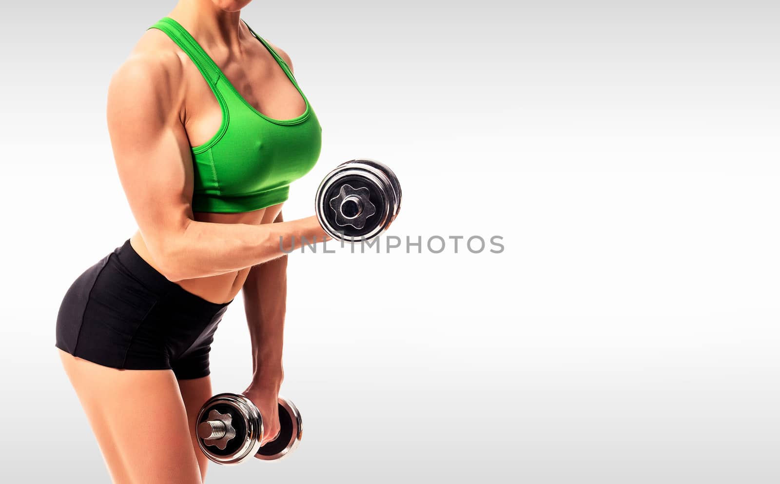 fitness woman with barbells on grey background