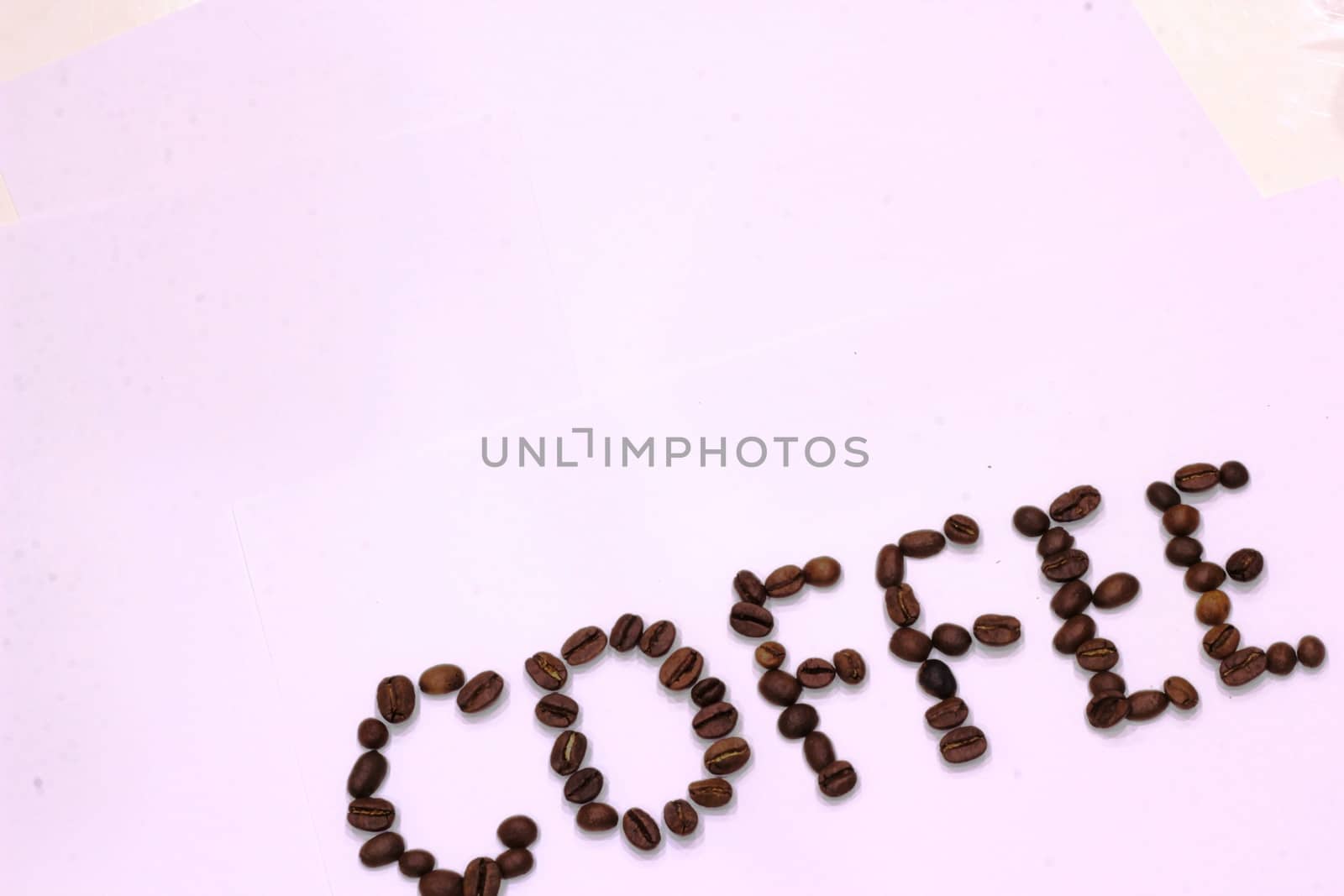 Inscription of Coffee from coffee beans on white background