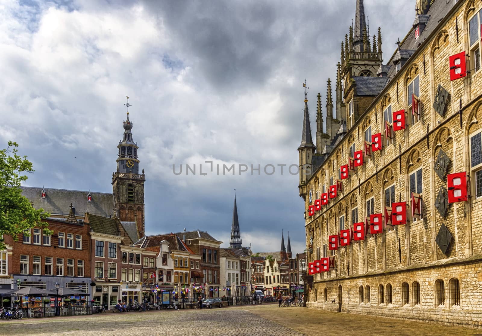 Market square with gothic city hall in Gouda, South Holland, Netherland by Elenaphotos21