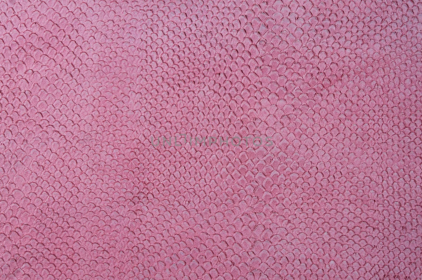 Pink leather texture closeup. Useful as for background.