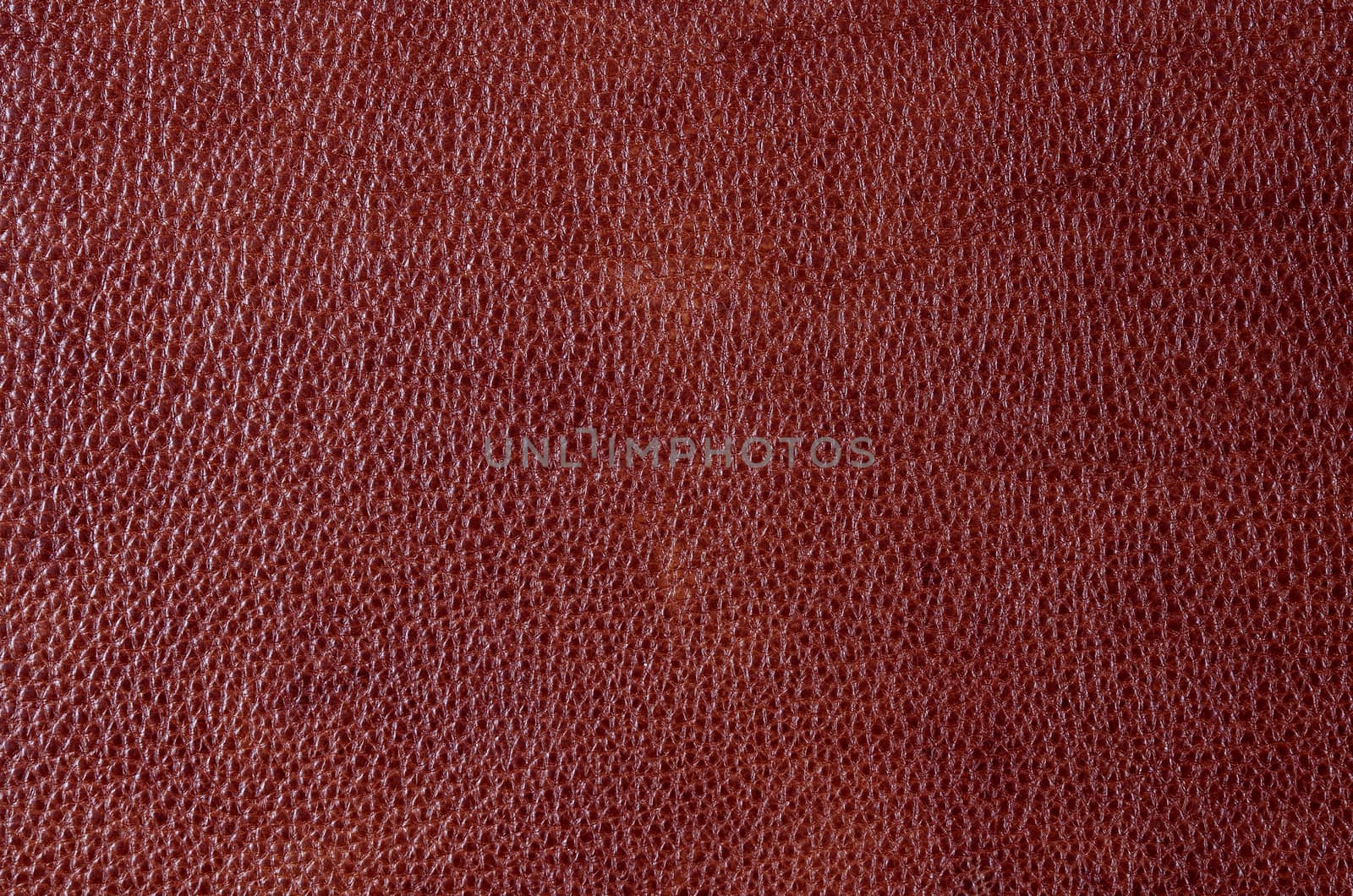 Brown leather texture closeup. Useful as for background.