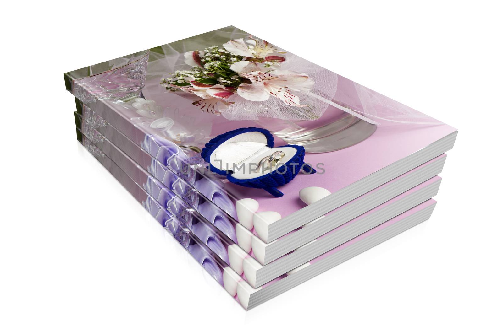 books  of  wedding rings and wedding favors on a colorful background