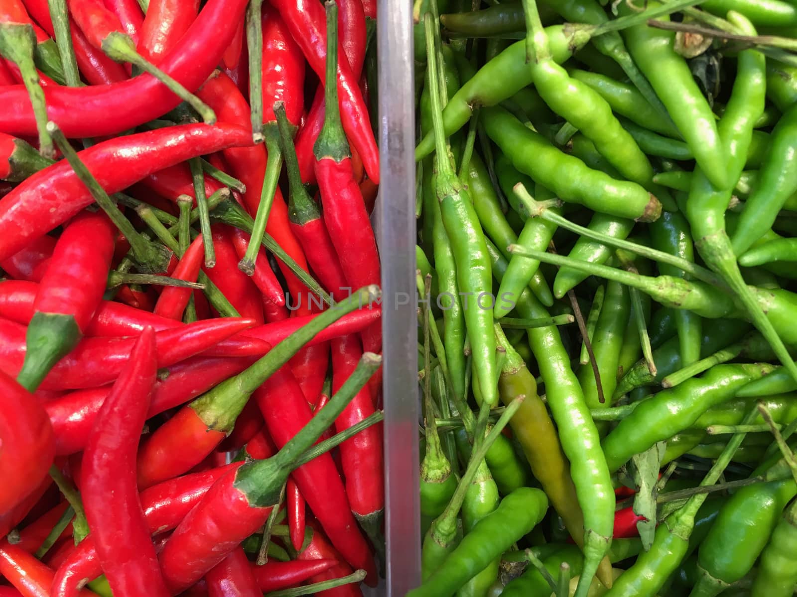 Closeup of red and green chili peppers.  Background of paprika hot spicy food ingredient.