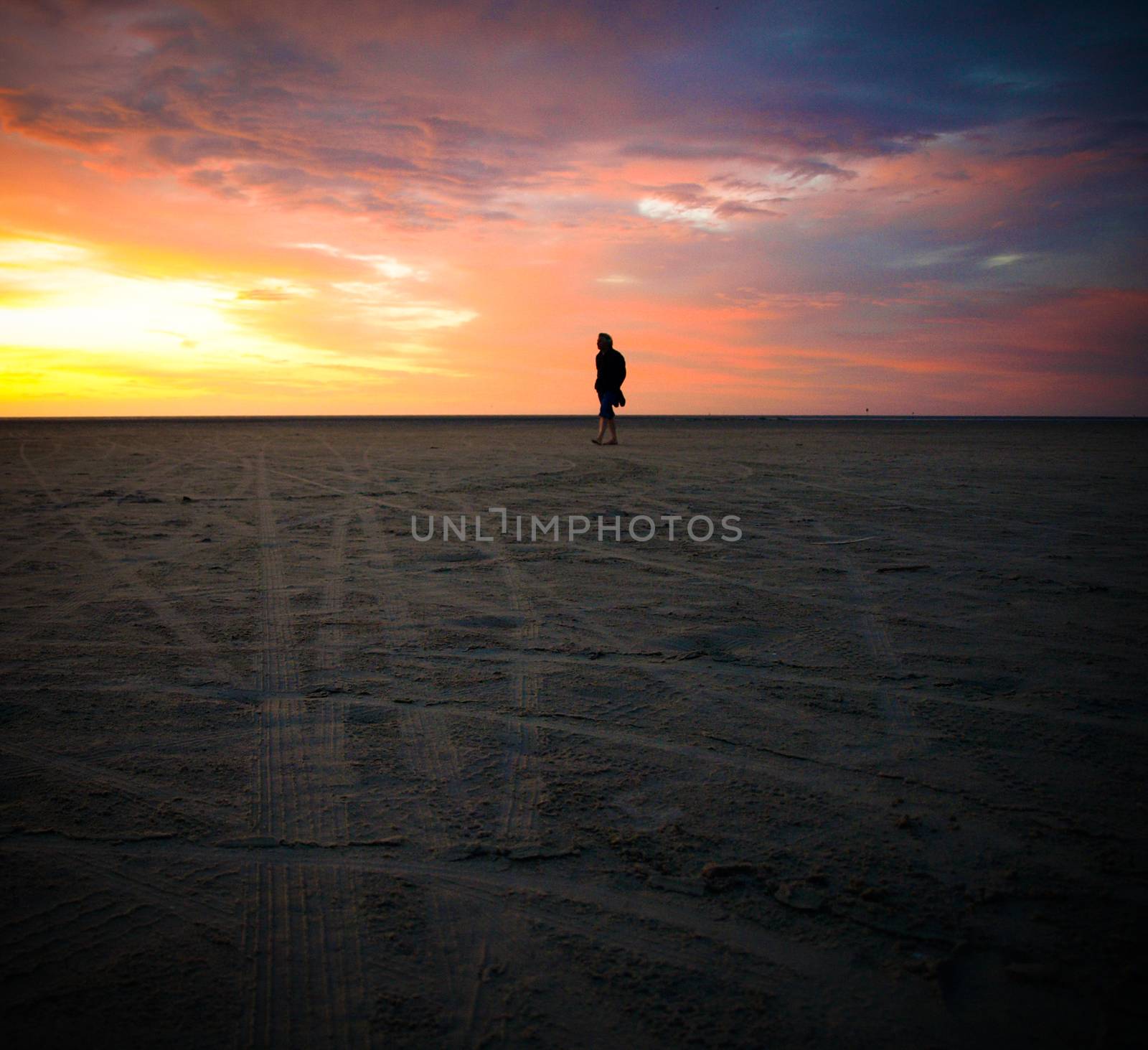 Silhouette of man looking the sunset beach by kimbo-bo