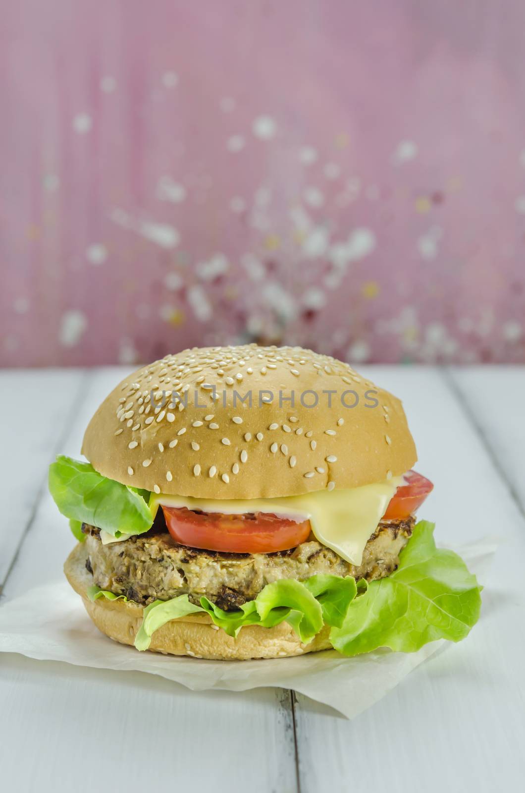 Closeup of home made burgers on wooden background