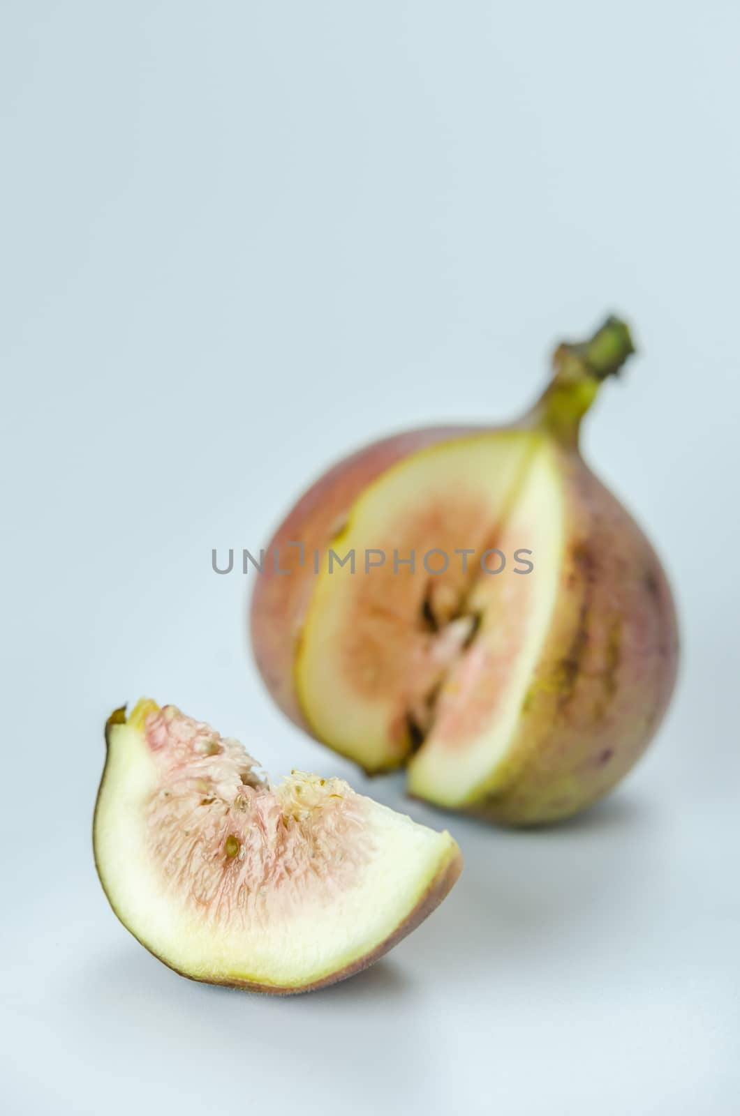 sliced fresh figs fruit on white background