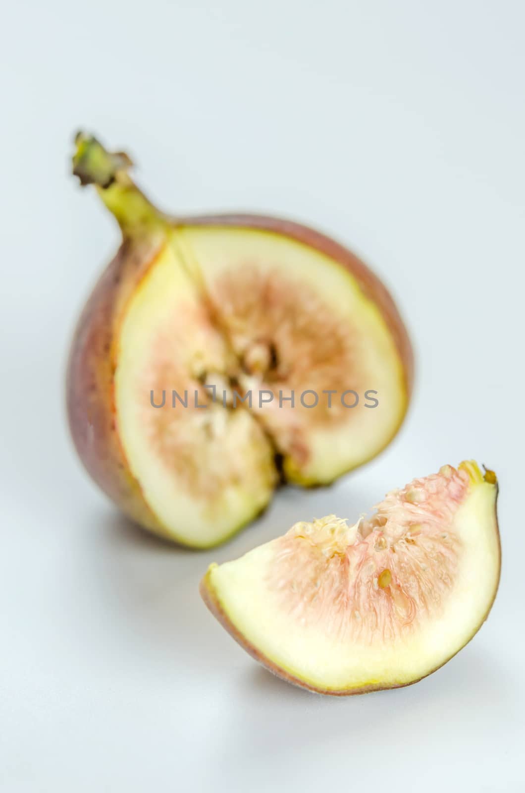 sliced fresh figs fruit on white background