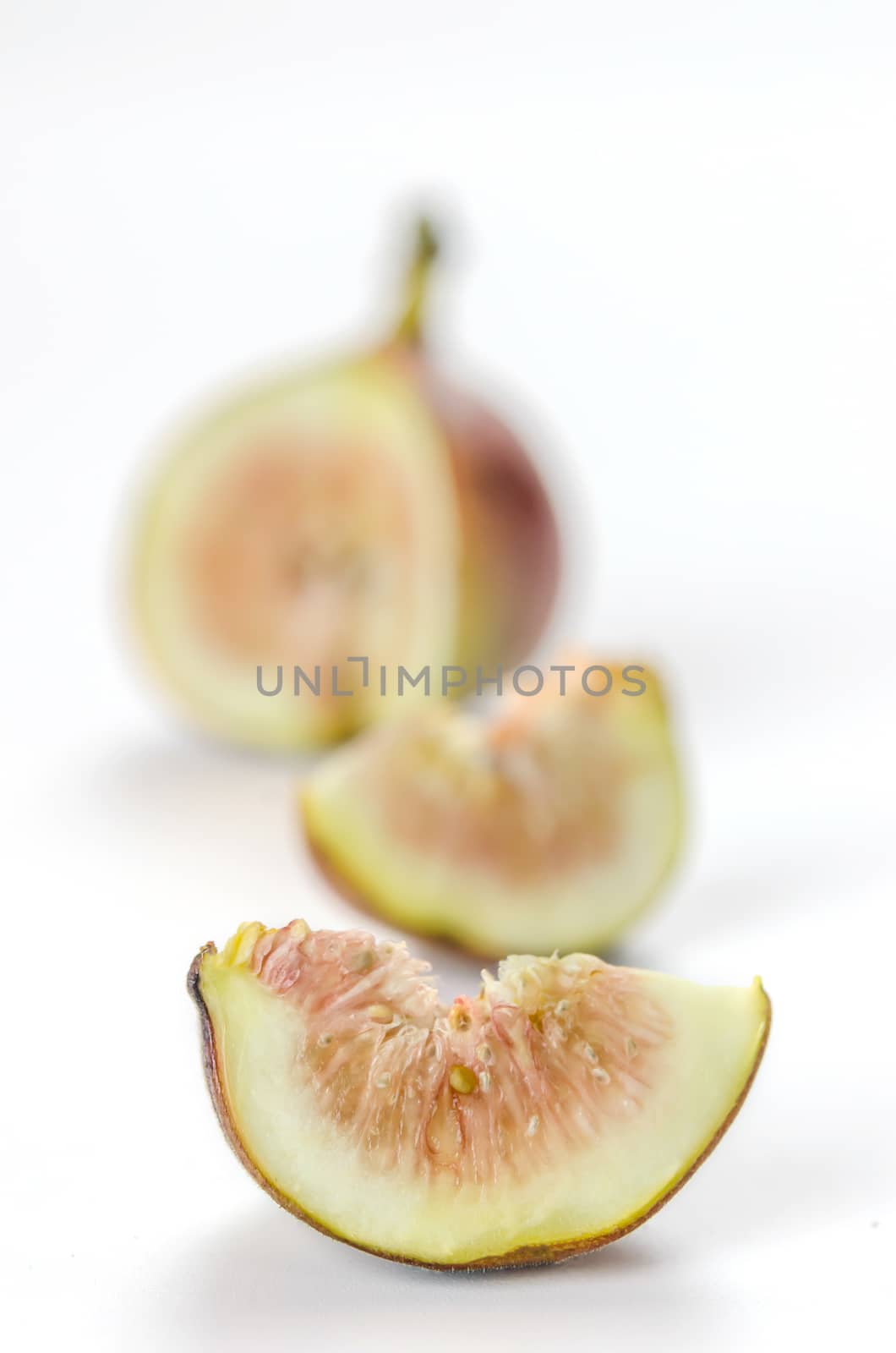 sliced fresh figs fruit on white background