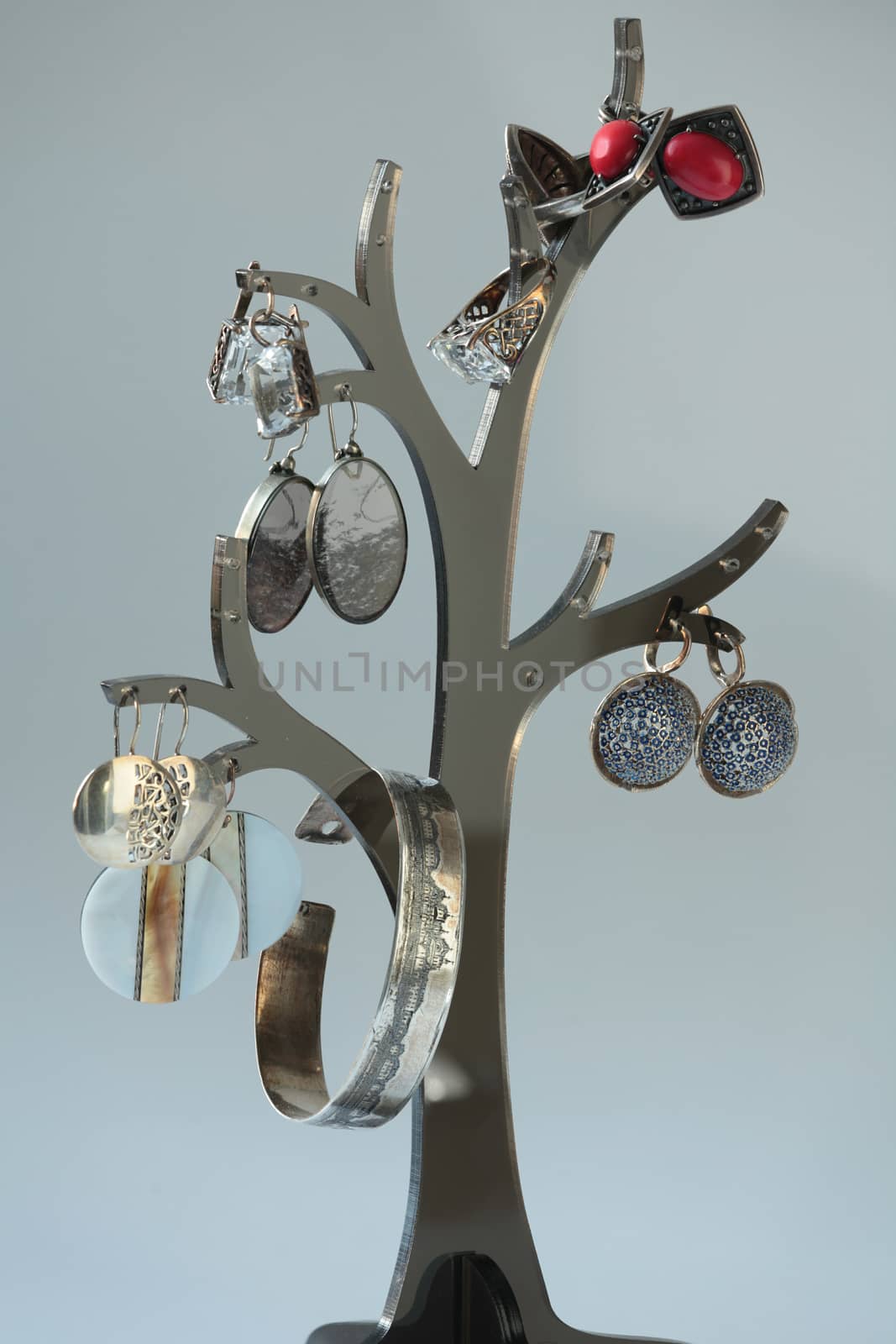 collection of vintage jewelry on tree