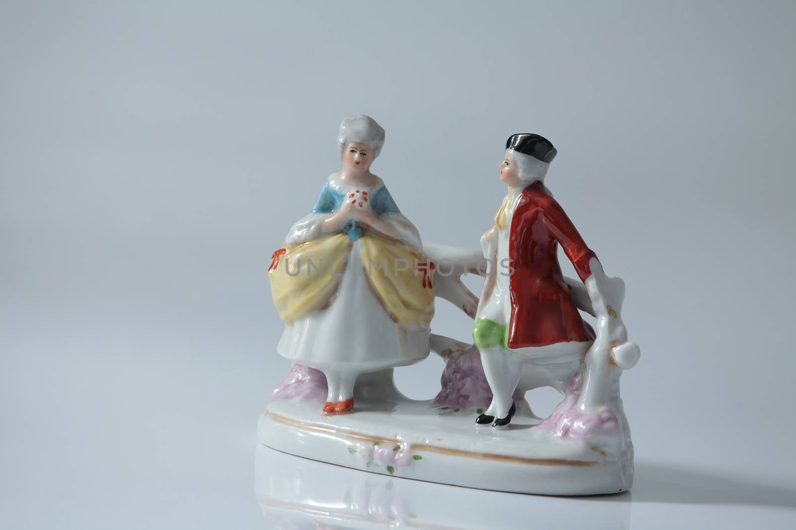 romantic encounter lovers statuette close to