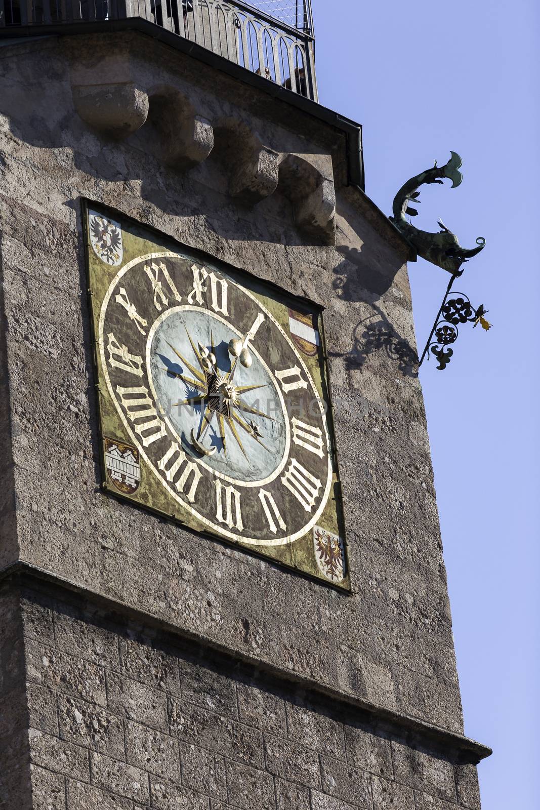 Clock of the Stadtturm a landmark watchtower built in the 1400s in Innsbruck, Austria