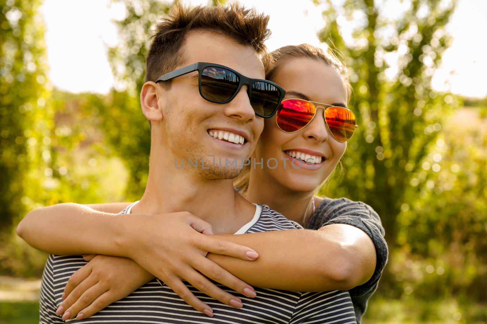 Portrait of a happy young couple embraced