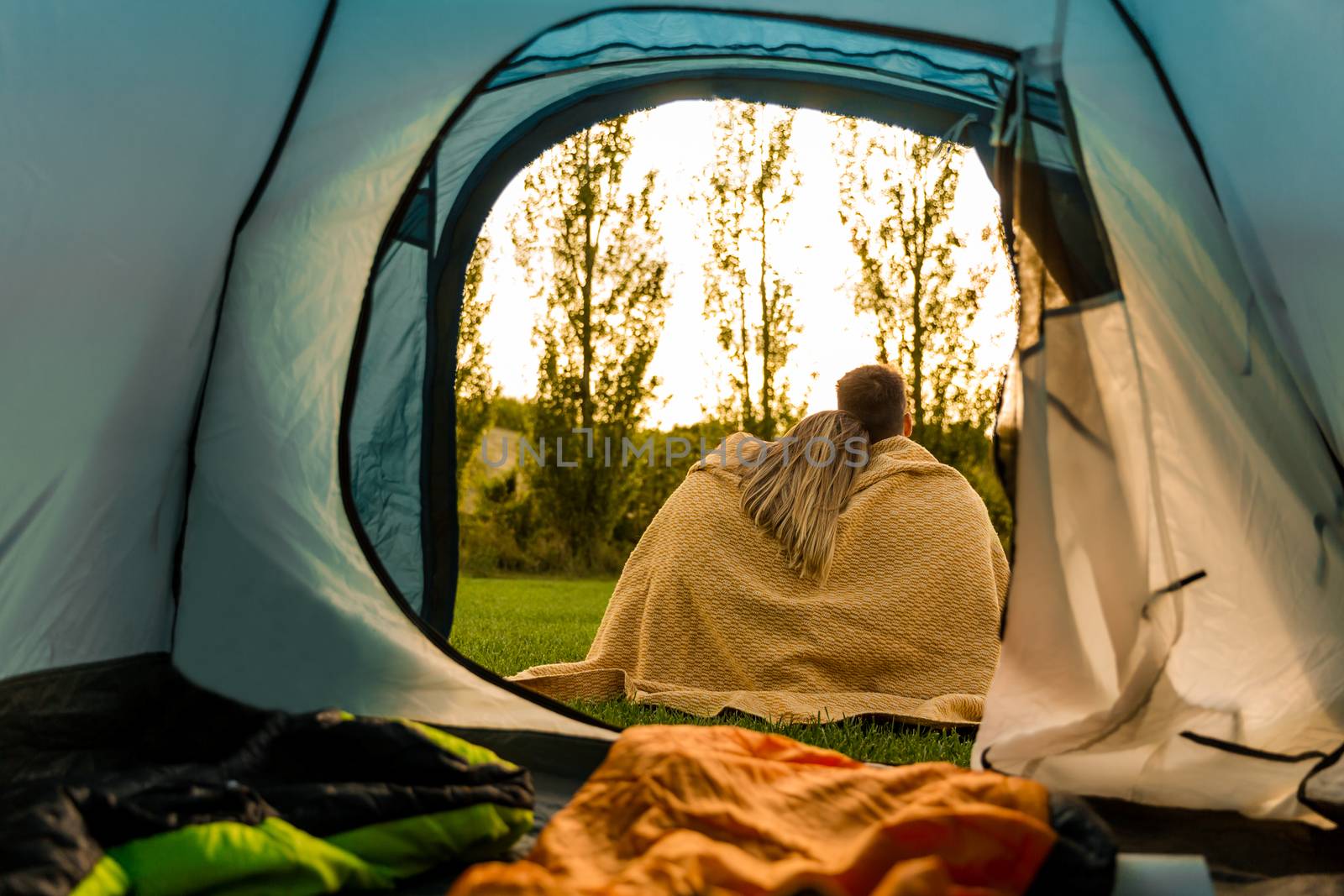 Shot of a happy couple camping on the nature