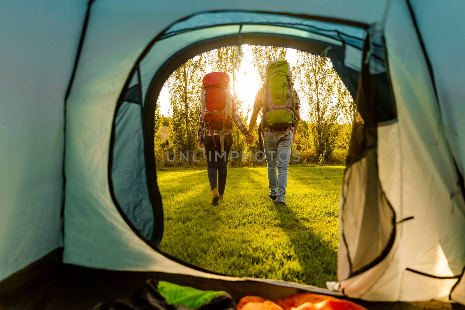 Shot of a happy couple camping on the nature