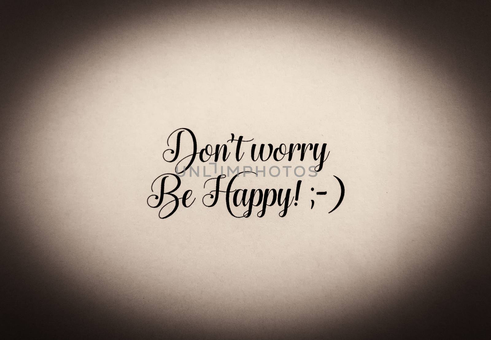 Be happy phrase written in black and white - sephia effect