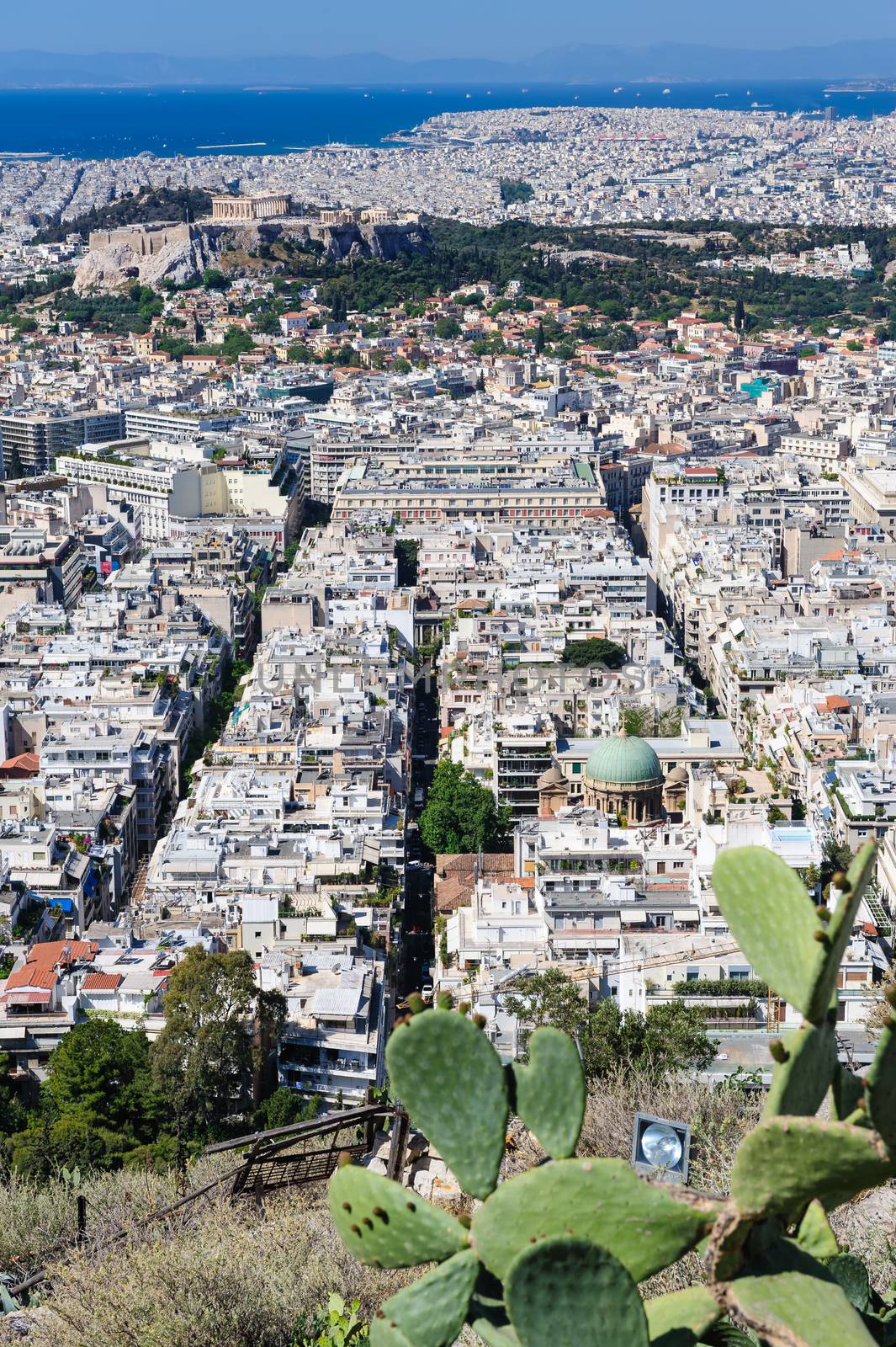 Athens Greece - April 27, 2016: Famous view from Lycabettus hill to modern city with Acropolis ans sea at background