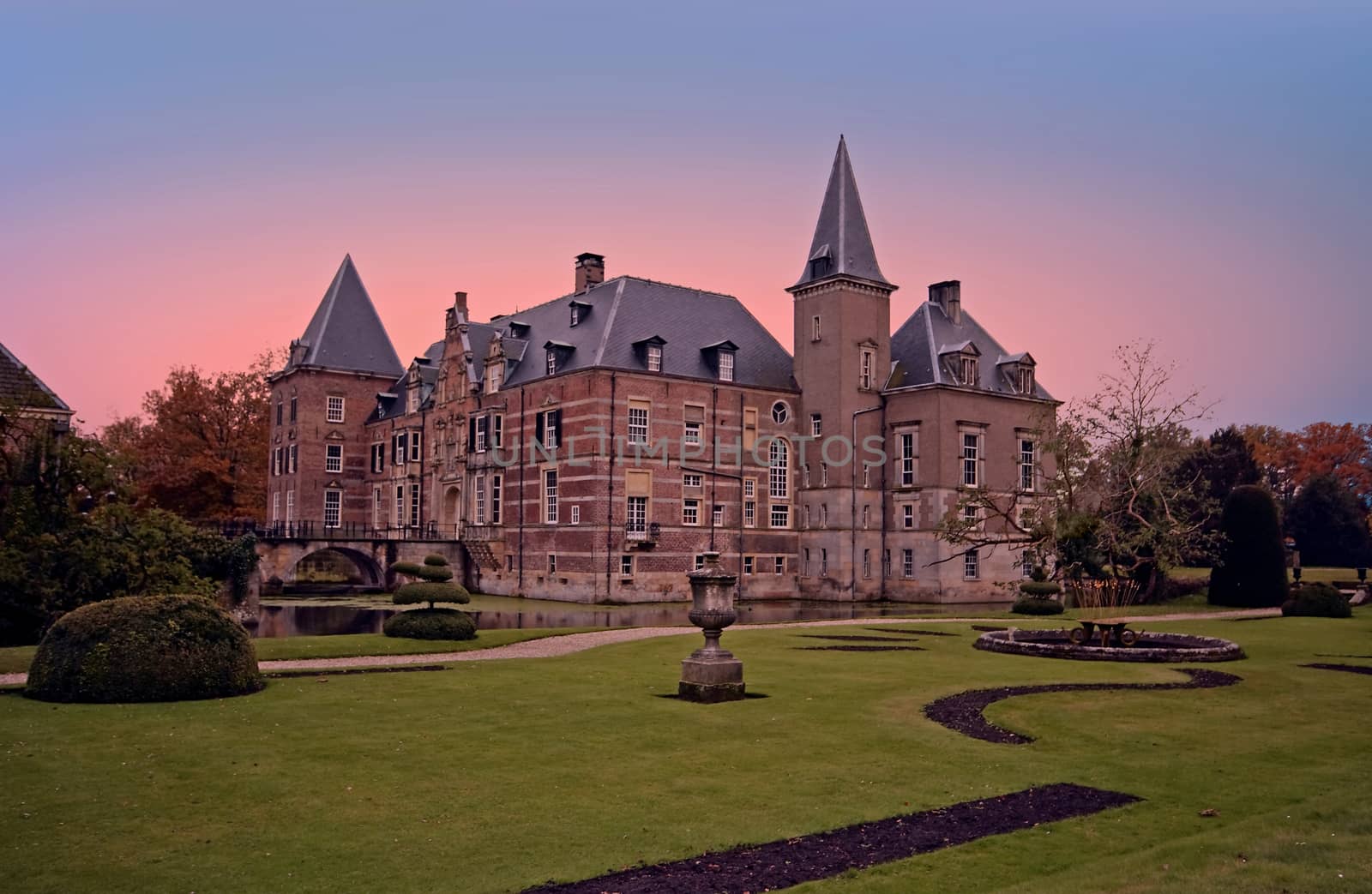 Late medieval castle 'Twickel' near Delden in the Netherlands at sunset

