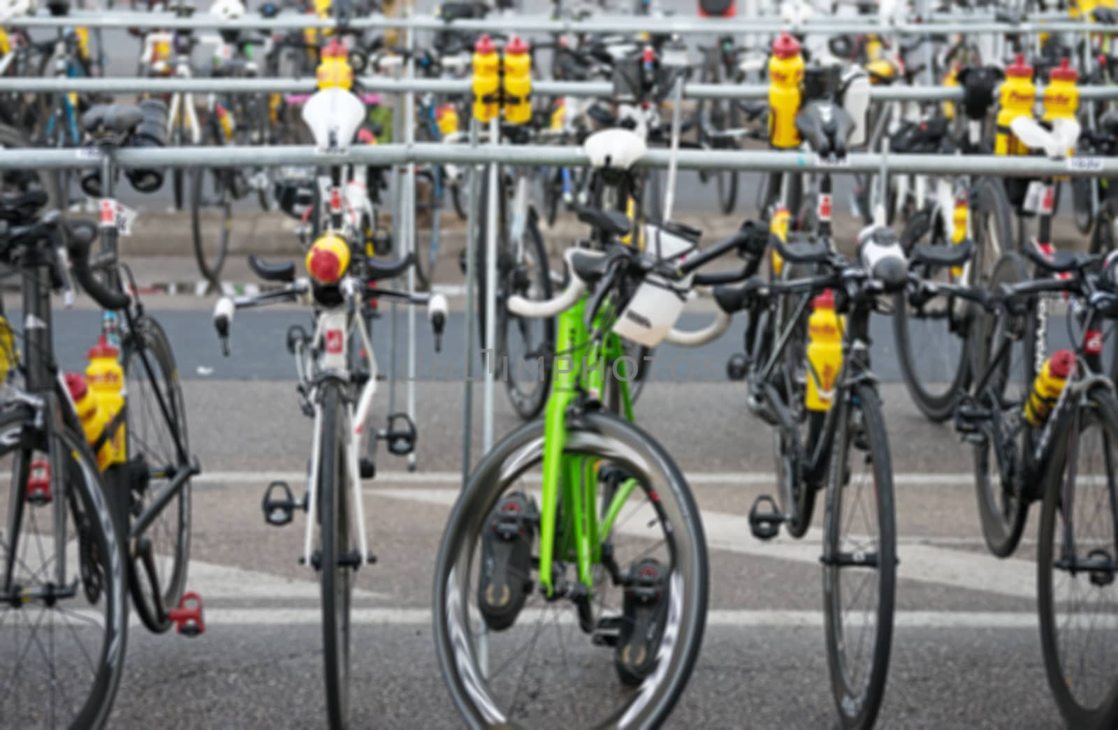 Many bicycles after race on the street. Blurred image.