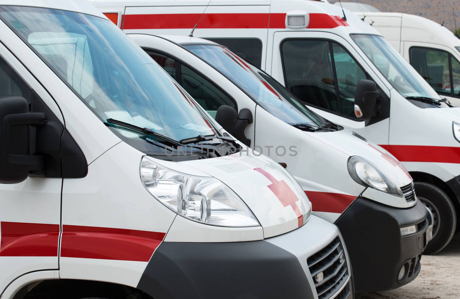 Ambulance cars parked on the beach.