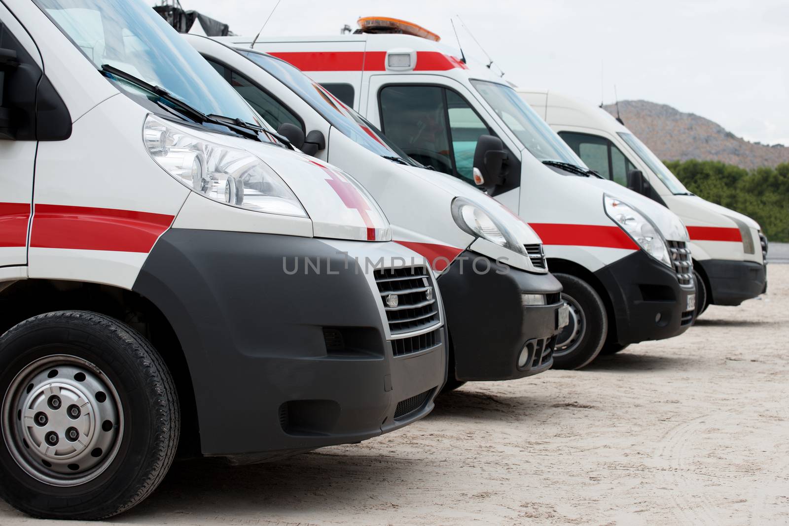 Ambulance cars parked on the beach. by dmitrimaruta