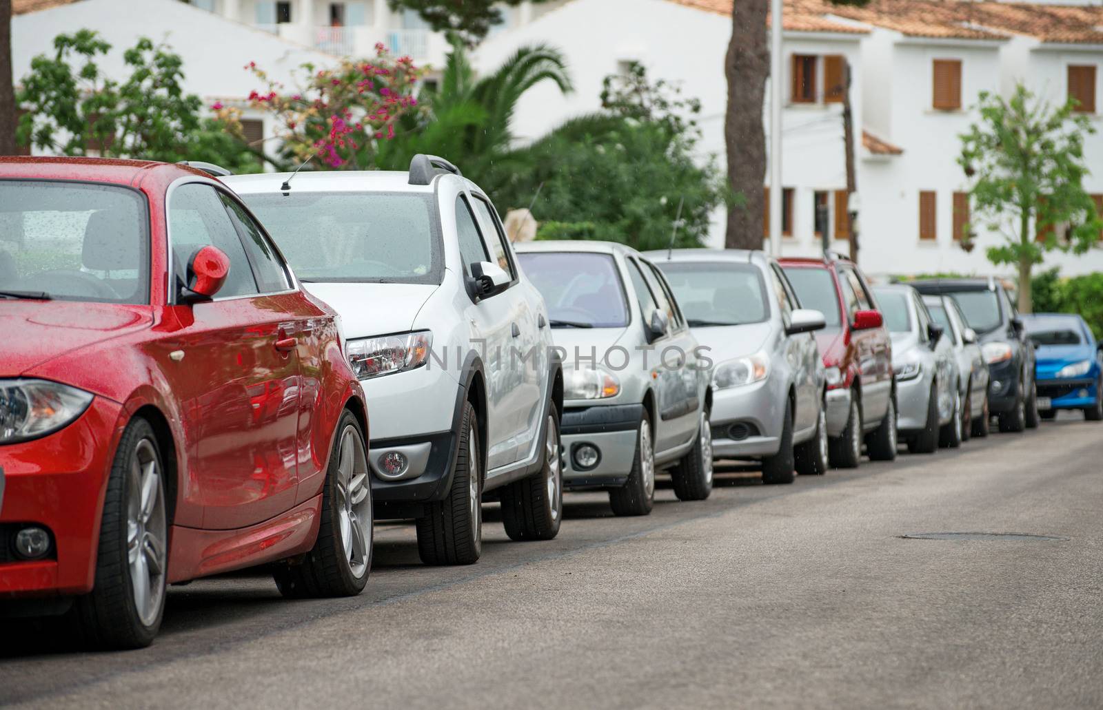 Cars parked along the street. by dmitrimaruta