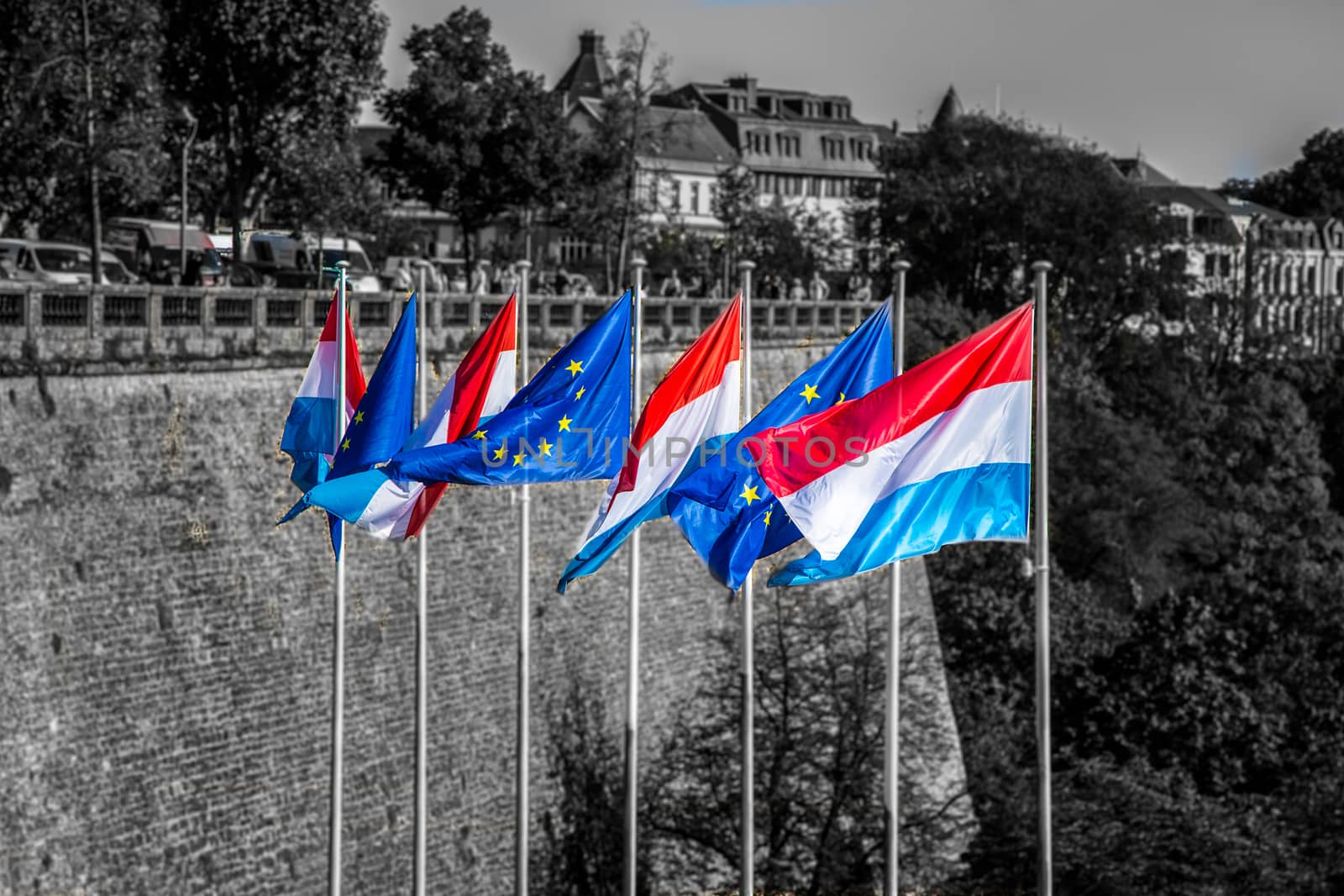 Waving flags of luxemburg and the european union at luxemburg