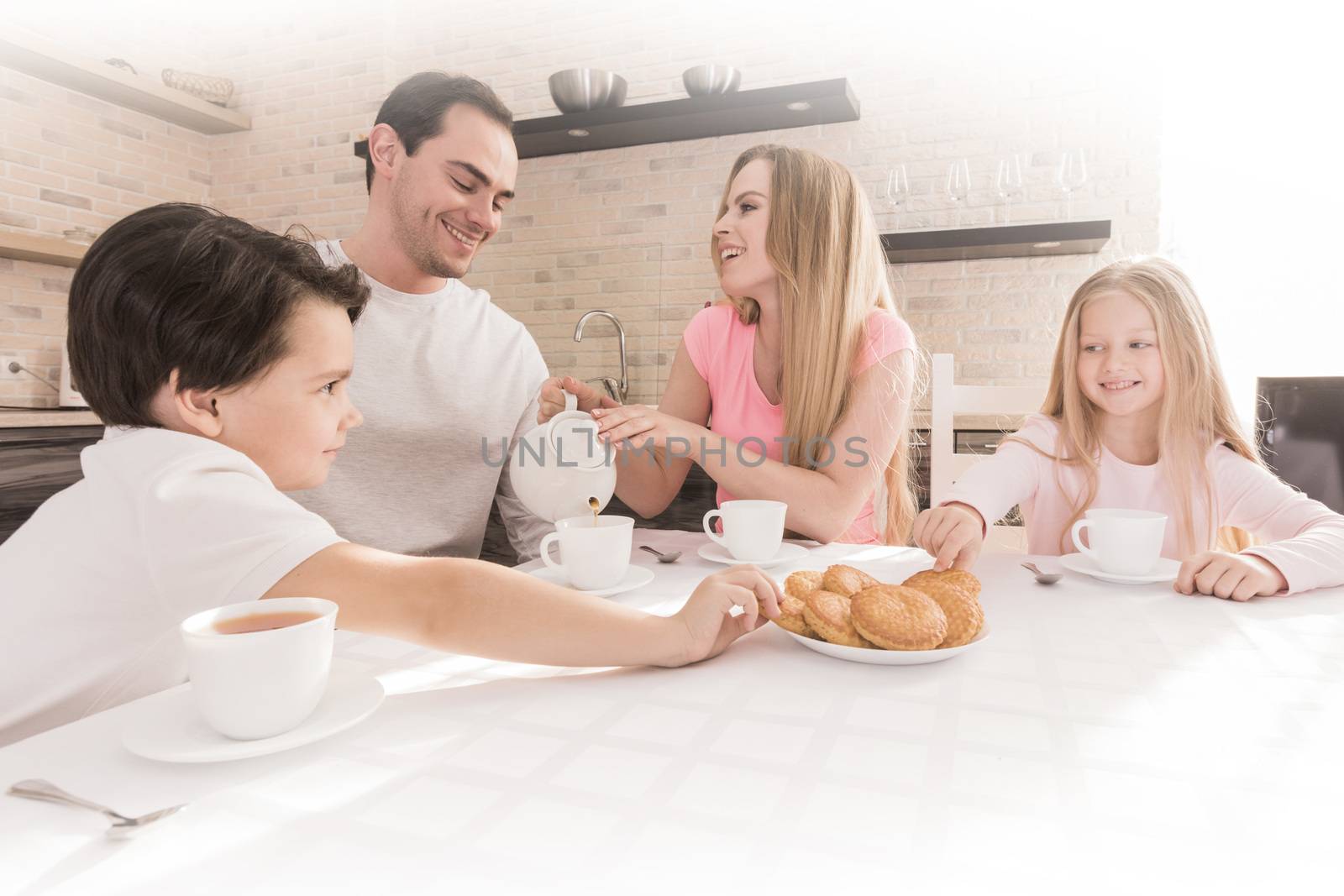 Family eating cookies by Yellowj