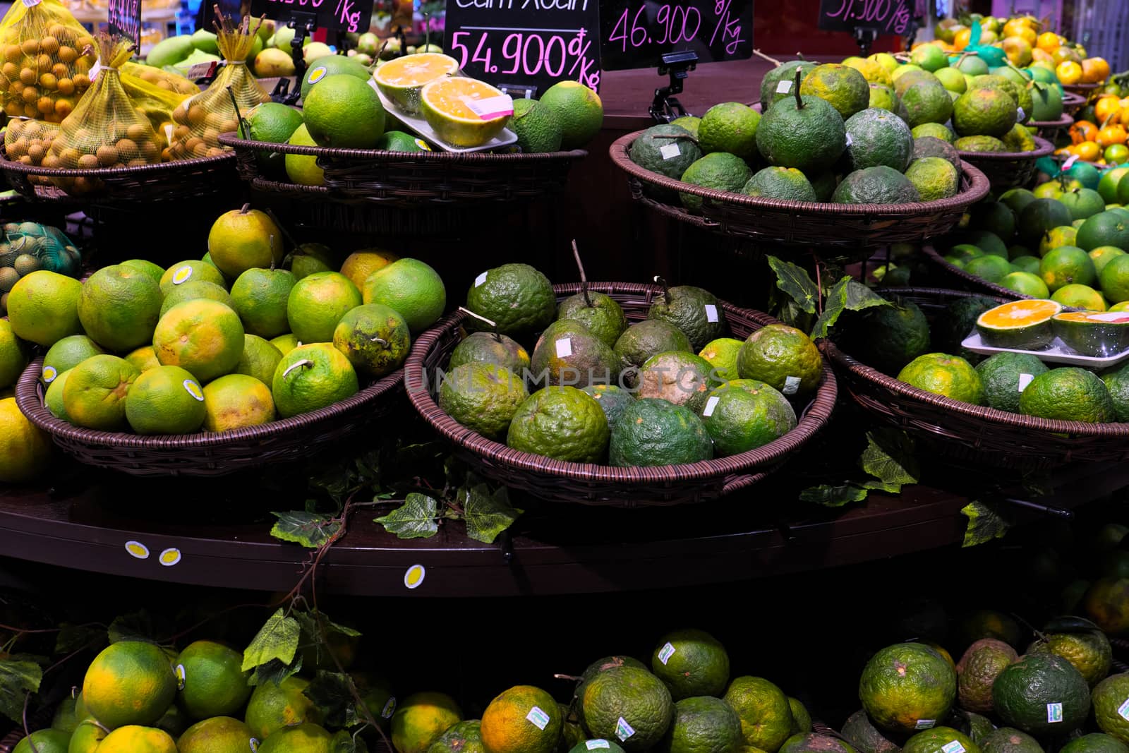 Fresh fruit store show in super market, orange basket on shelf with price, this kind of fruits rich vitamin c, good for health