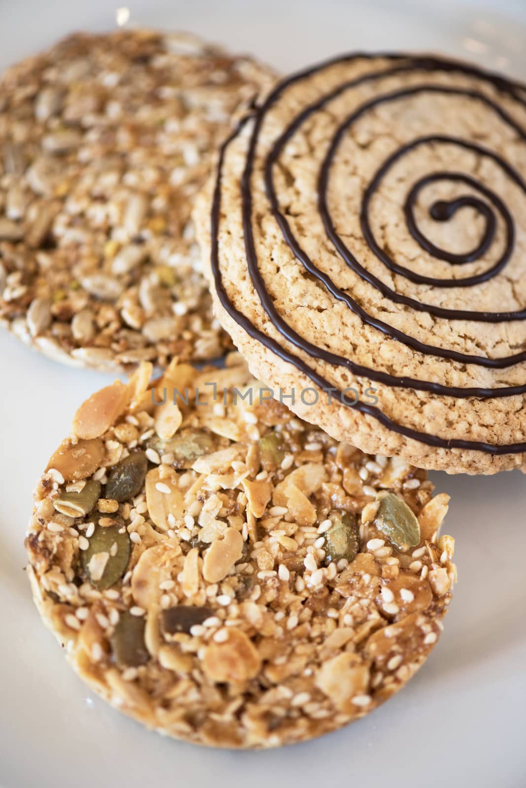 Mixed cookies on a white plate