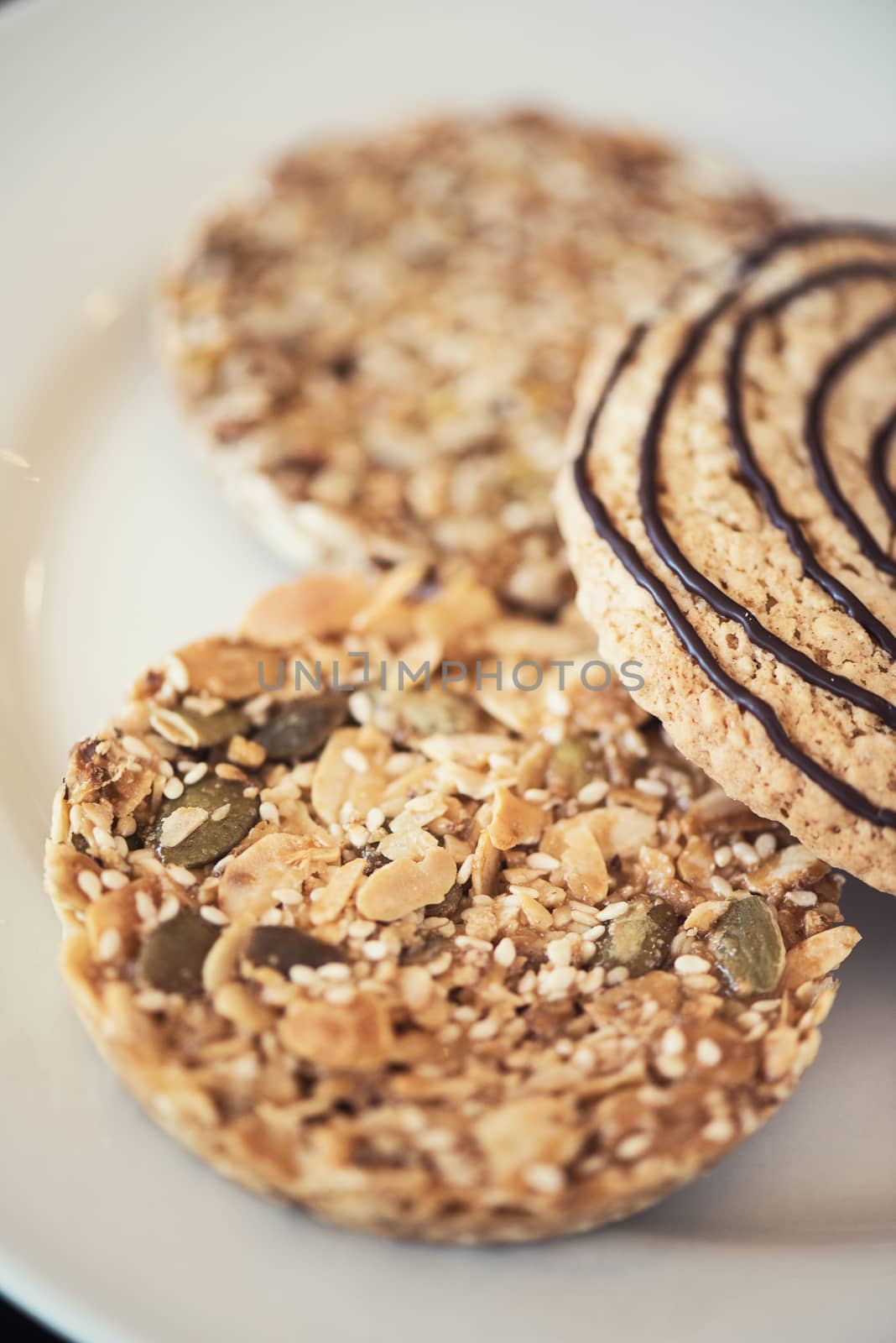Mixed cookies on a white plate