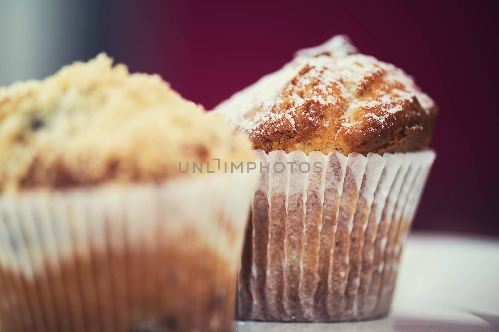 different muffins with fresh apples on white