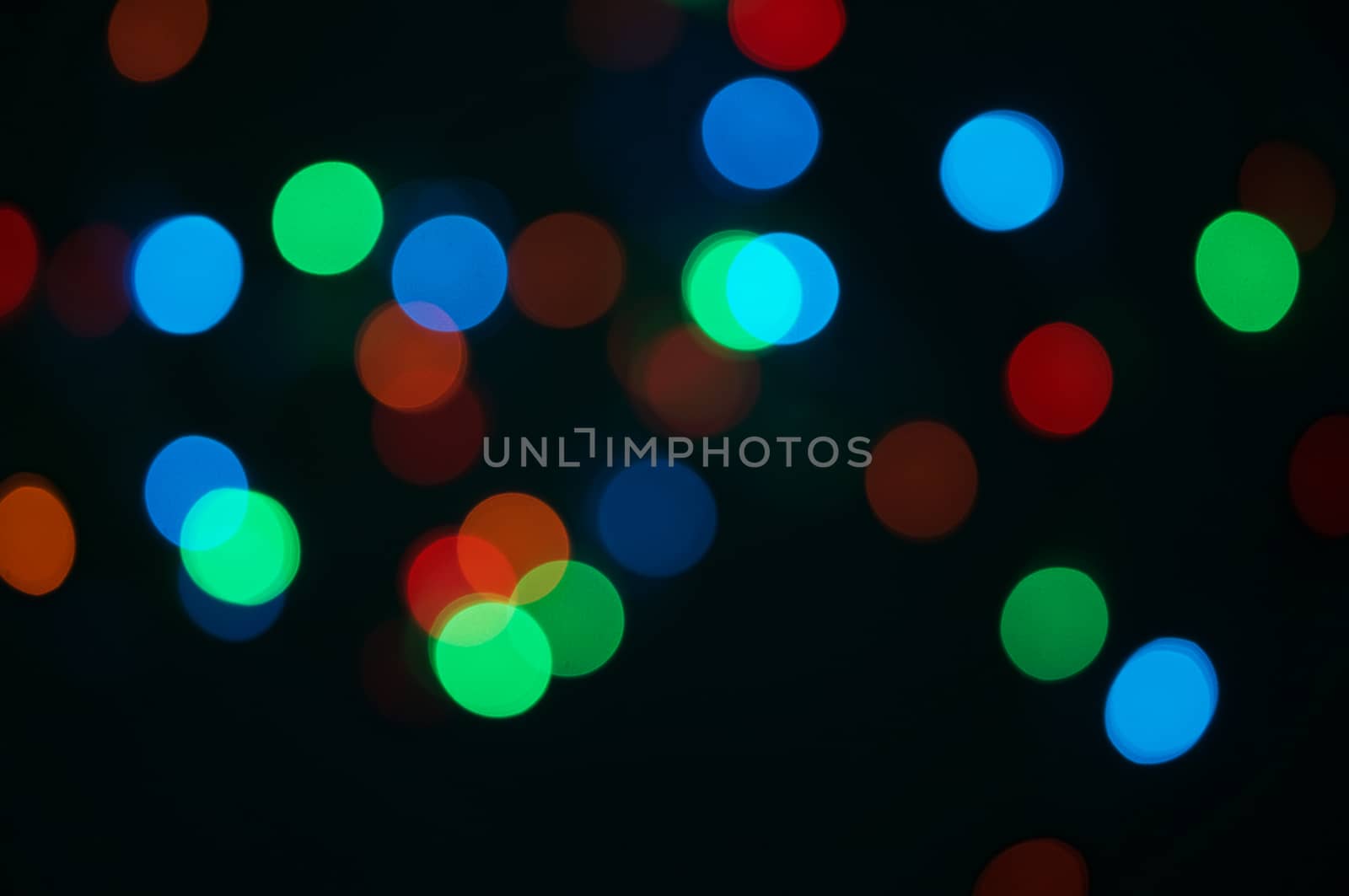 Colorful bokeh circle or defocused of glitter at night as background.