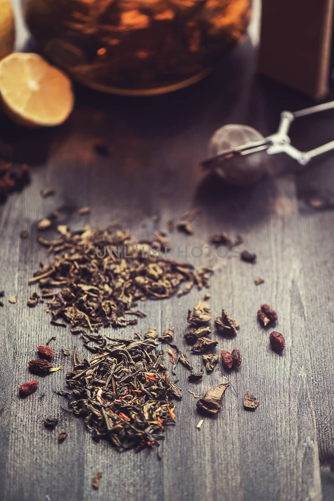 tea composition with cinnamon sticks, lemons