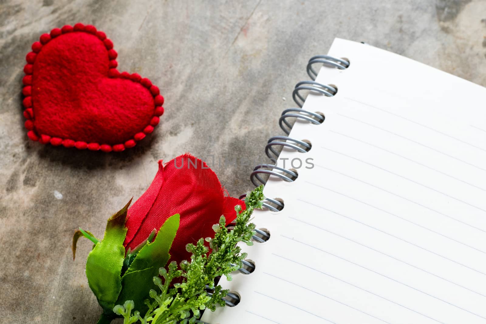 Valentines day background. Valentine hearts with open blank notebook on dark wooden background. Writing romantic letters