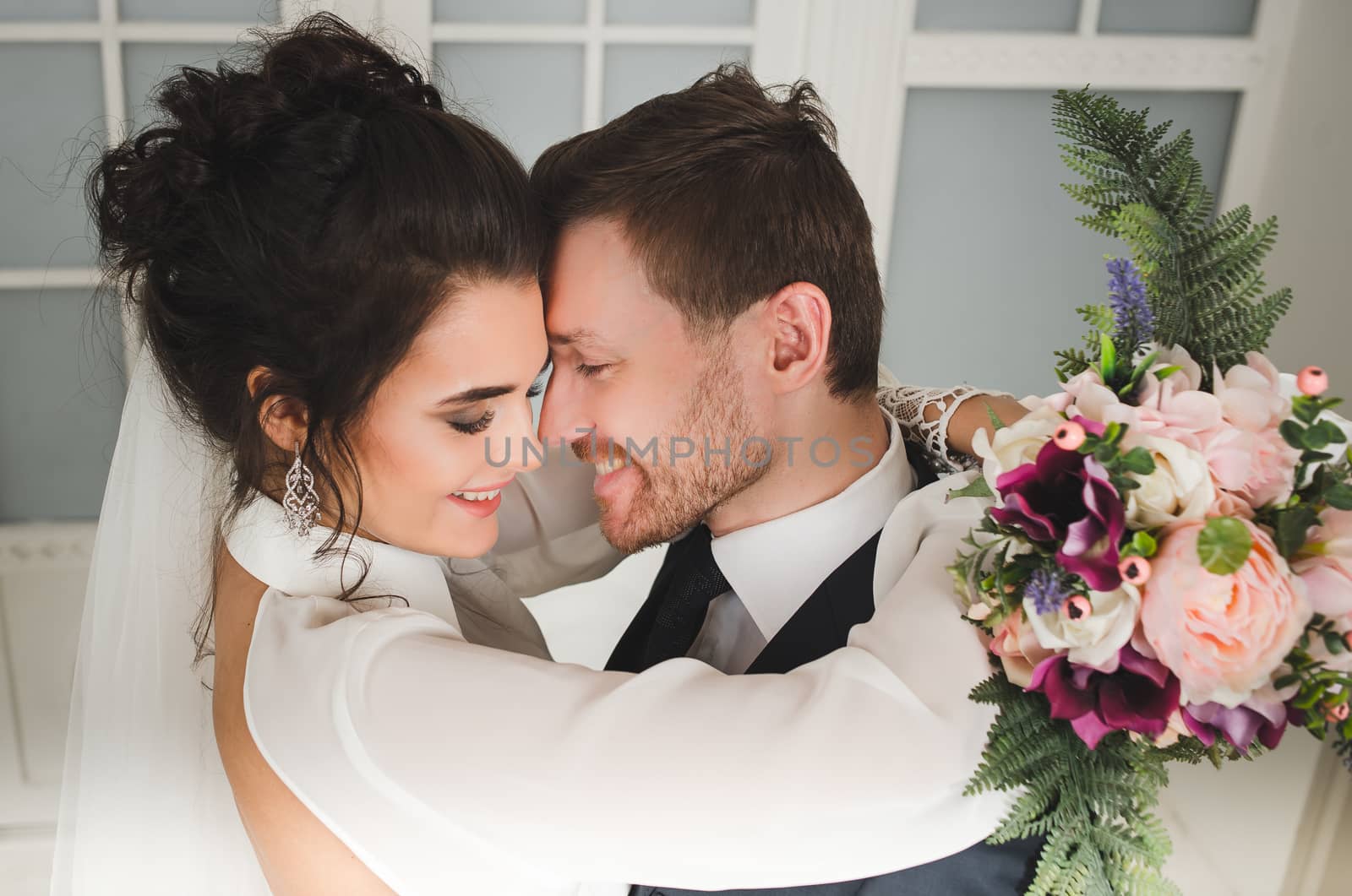 Bride and groom with bridal bouquet ready for wedding