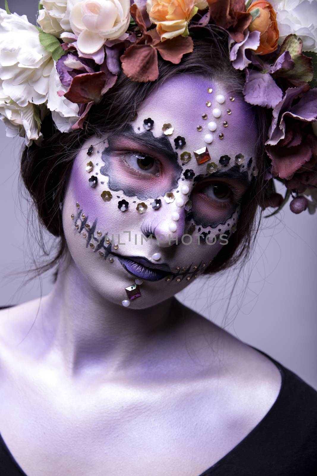 Portrait of a beautiful Halloween model with creative make up